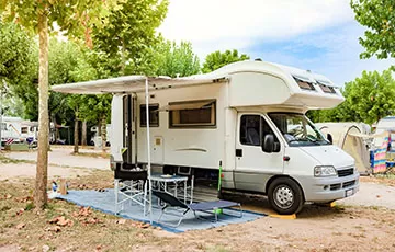 A camper set up on a campground.