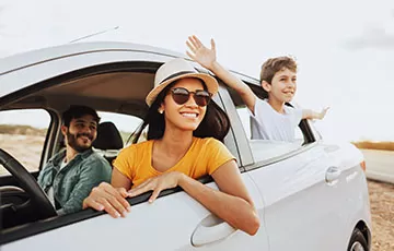 A family goes on a road trip after saving money with a credit union auto loan refinance.